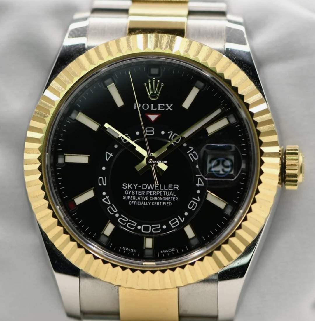 Rolex Sky-Dweller 326933 – Gold and Silver with Oyster Bracelet and Gold Bezel This Rolex Sky-Dweller (Ref. 326933) features dual time zones and an annual calendar, making it the most complicated watch Rolex produces. The watch comes with the outer box, inner box, manual, and warranty card. We are based in Honolulu and offer fully insured shipping via FedEx or UPS. If you’d like a closer look, we can arrange a call or FaceTime session to answer any questions. Condition: The watch is in excellent condition with some signs of wear. Please review the photos for an accurate representation of its condition. It keeps time well, running within Rolex's standards of accuracy. We guarantee this watch is 100% authentic. Customer satisfaction is our top priority. Details: Model: Rolex Sky-Dweller Reference Number: 326933 Case Material: Stainless Steel and 18k Yellow Gold Case Size: 42mm Bezel: Fluted 18k Yellow Gold Dial: Champagne or White with Luminous Hour Markers and Dual Time Display Crystal: Scratch-Resistant Sapphire with Cyclops Lens over the Date Bracelet: Stainless Steel and 18k Yellow Gold Oyster Bracelet (Fits 7”+ wrist) Movement: Automatic Rolex Caliber 9001 with Dual Time and Annual Calendar Function Water Resistance: 100 meters (330 feet) Feel free to message me with any questions or inquiries!